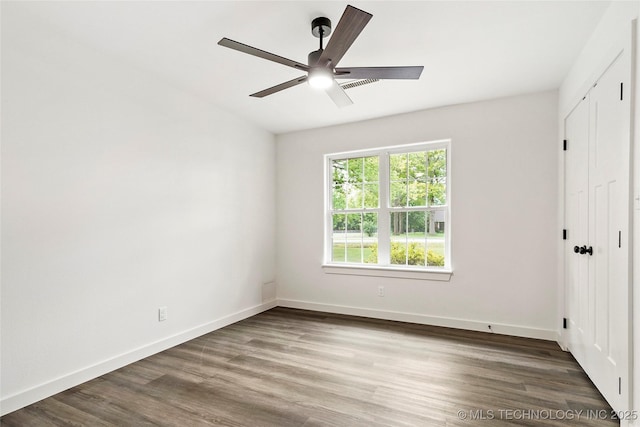 10062 E Northshire St, Claremore, OK 74017 - unfurnished bedroom featuring wood finished floors, a closet, and ceiling fan