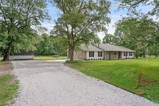 10062 E Northshire St, Claremore, OK 74017 - single story home with driveway and stone siding