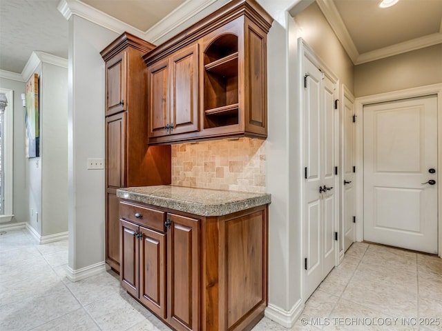 9025 N 100th E Ave, Owasso, OK 74055 - kitchen featuring tile countertops, backsplash, light tile patterned flooring, crown molding, and open shelves
