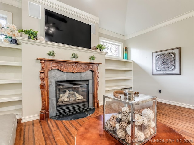 9025 N 100th E Ave, Owasso, OK 74055 - detailed view of a tile fireplace, wood finished floors, and ornamental molding