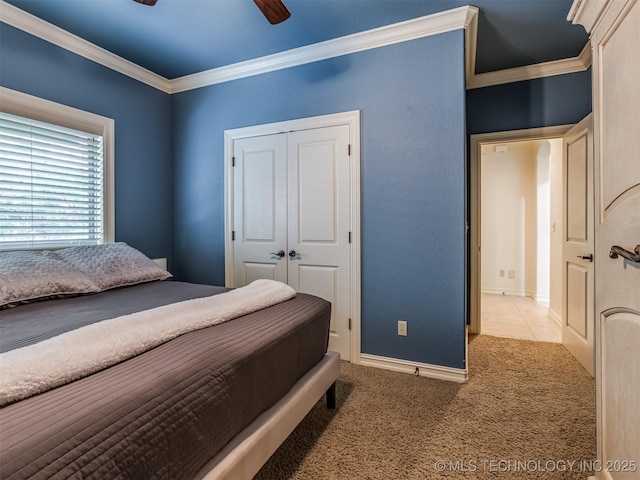 9025 N 100th E Ave, Owasso, OK 74055 - bedroom featuring crown molding, carpet, a closet, and ceiling fan