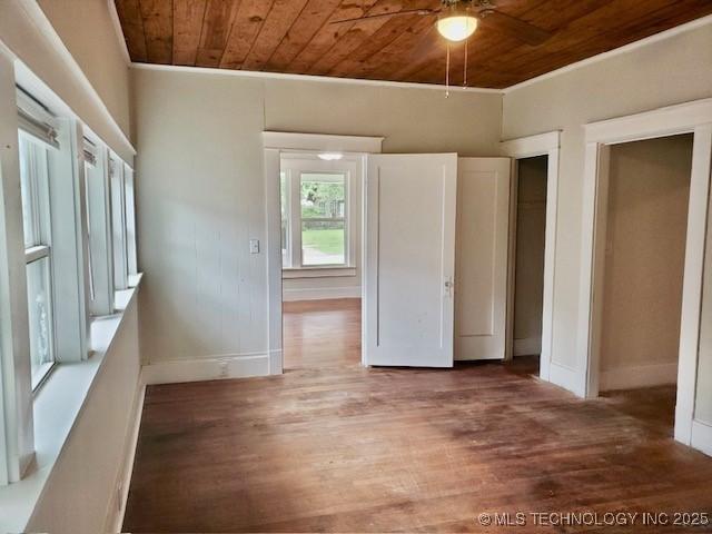 1319 Bixby St, Ardmore, OK 73401 - unfurnished bedroom with wooden ceiling, wood finished floors, and ornamental molding