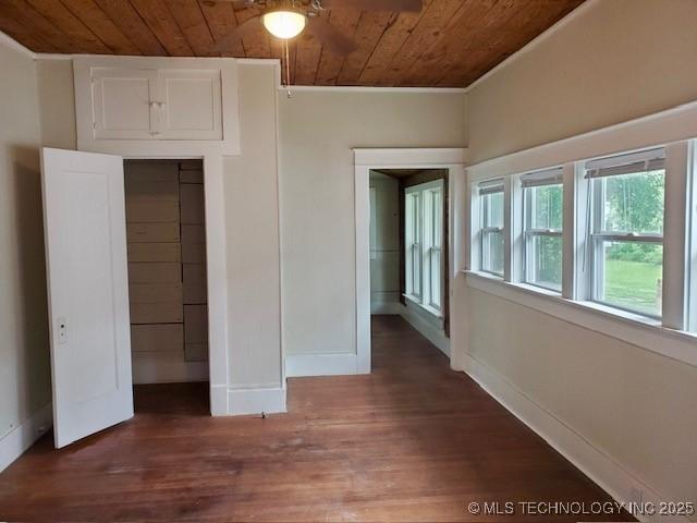 1319 Bixby St, Ardmore, OK 73401 - unfurnished bedroom featuring wooden ceiling, ornamental molding, wood finished floors, and a closet