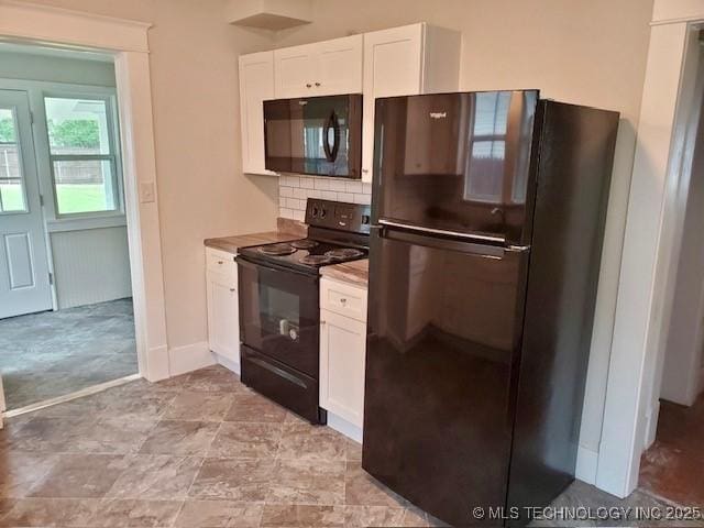 1319 Bixby St, Ardmore, OK 73401 - kitchen featuring black appliances, white cabinets, and backsplash