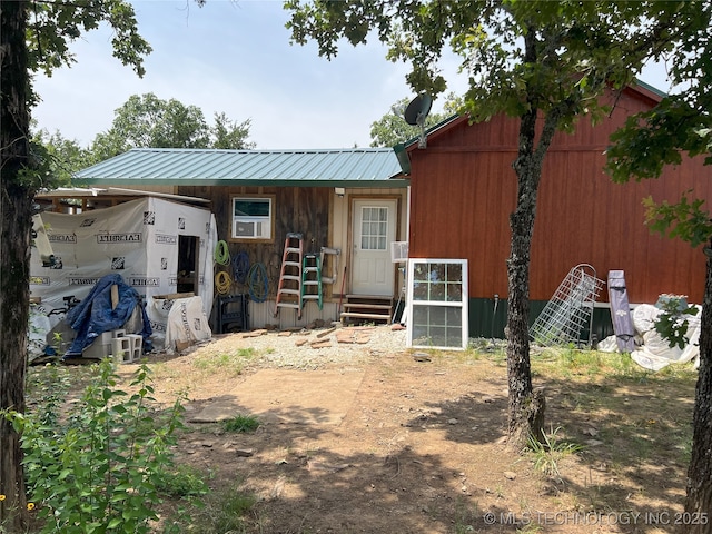 183006 N 4170th Rd, Moyers, OK 74557 - back of property with entry steps and a metal roof