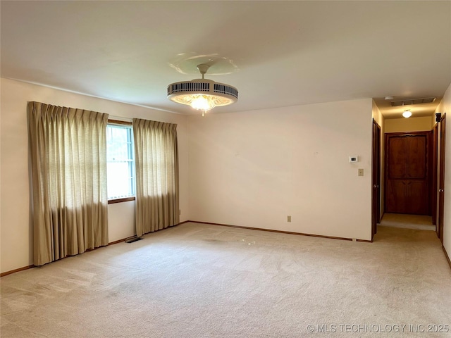 705 W 3rd St, Skiatook, OK 74070 - unfurnished room with light carpet and baseboards