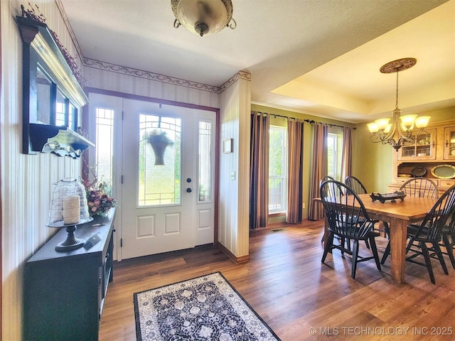 17978 W Stone Chapel Rd, Tahlequah, OK 74464 - entrance foyer featuring a chandelier, dark wood-style flooring, and a tray ceiling