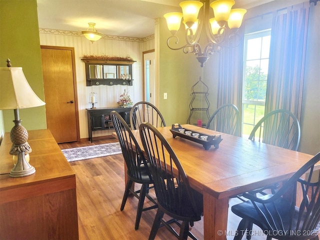 17978 W Stone Chapel Rd, Tahlequah, OK 74464 - dining area featuring a chandelier and wood finished floors