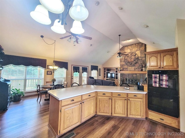17978 W Stone Chapel Rd, Tahlequah, OK 74464 - kitchen with ceiling fan, light countertops, vaulted ceiling, and dark wood-style floors
