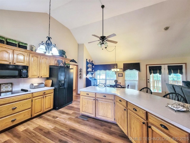 17978 W Stone Chapel Rd, Tahlequah, OK 74464 - kitchen with black appliances, a chandelier, a ceiling fan, light countertops, and light wood-type flooring