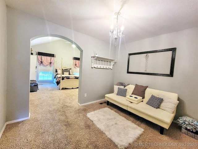17978 W Stone Chapel Rd, Tahlequah, OK 74464 - carpeted living room with arched walkways and a chandelier