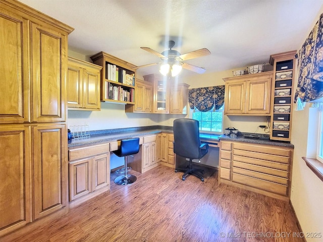 17978 W Stone Chapel Rd, Tahlequah, OK 74464 - home office featuring built in study area, light wood-style flooring, and a ceiling fan