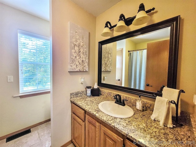 17978 W Stone Chapel Rd, Tahlequah, OK 74464 - bathroom with vanity and tile patterned floors