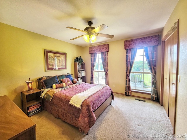 17978 W Stone Chapel Rd, Tahlequah, OK 74464 - bedroom with multiple windows, carpet floors, and a ceiling fan