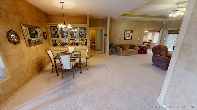 3302 Callaway Dr, Claremore, OK 74019 - carpeted dining room with ceiling fan, a chandelier, ornamental molding, and a raised ceiling