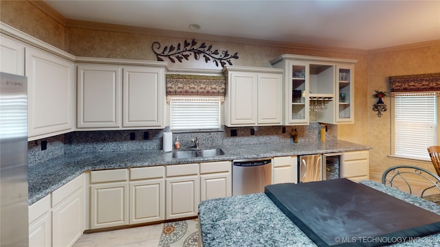 3302 Callaway Dr, Claremore, OK 74019 - kitchen featuring stainless steel appliances, decorative backsplash, wine cooler, glass insert cabinets, and ornamental molding