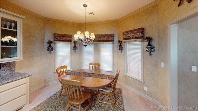 3302 Callaway Dr, Claremore, OK 74019 - dining space featuring light wood-type flooring, healthy amount of natural light, a chandelier, and ornamental molding