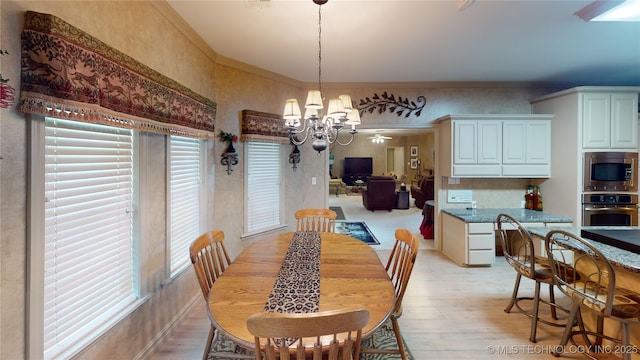 3302 Callaway Dr, Claremore, OK 74019 - dining room with plenty of natural light, light wood-style flooring, a chandelier, and crown molding