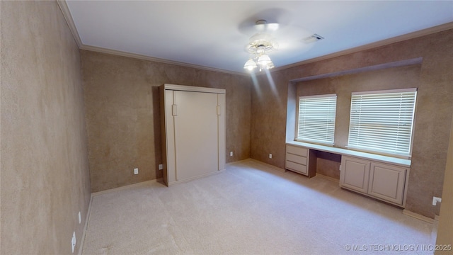 3302 Callaway Dr, Claremore, OK 74019 - unfurnished bedroom featuring built in desk, crown molding, and light carpet