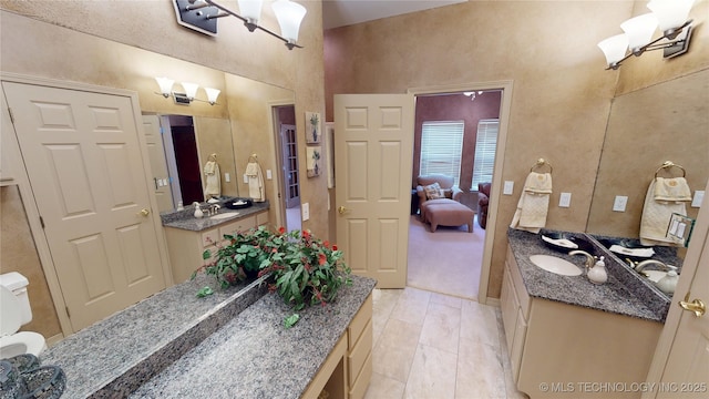 3302 Callaway Dr, Claremore, OK 74019 - bathroom featuring vanity and a towering ceiling