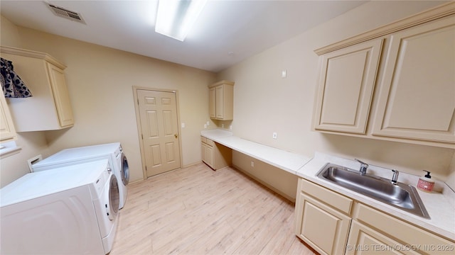 3302 Callaway Dr, Claremore, OK 74019 - washroom with cabinet space, separate washer and dryer, and light wood finished floors