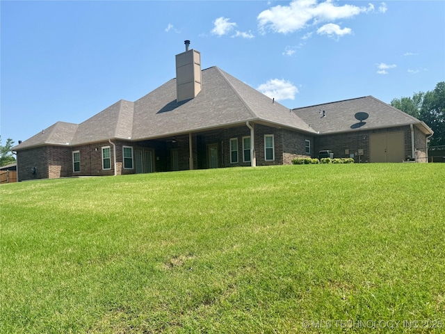 3302 Callaway Dr, Claremore, OK 74019 - back of house with a yard, brick siding, a chimney, and a shingled roof