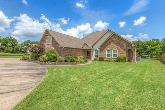 3302 Callaway Dr, Claremore, OK 74019 - view of front of home with brick siding, a shingled roof, and driveway