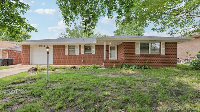 4944 Cornell Dr, Bartlesville, OK 74006 - ranch-style home featuring a garage, brick siding, and concrete driveway