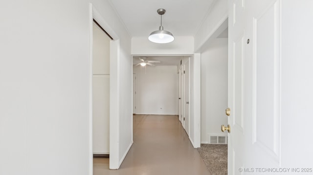 4944 Cornell Dr, Bartlesville, OK 74006 - hall with finished concrete flooring and ornamental molding