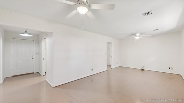 4944 Cornell Dr, Bartlesville, OK 74006 - spare room featuring ceiling fan and concrete flooring