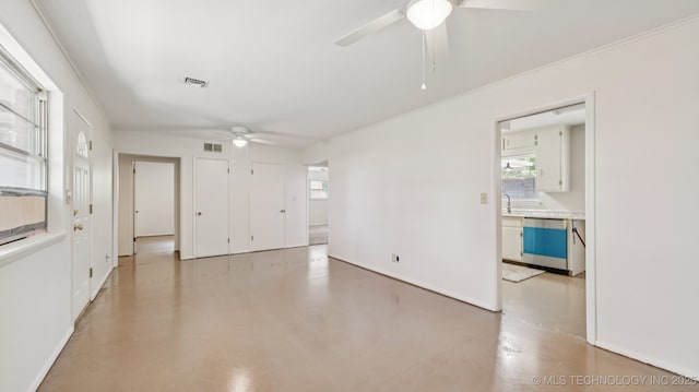 4944 Cornell Dr, Bartlesville, OK 74006 - unfurnished room featuring ceiling fan, plenty of natural light, and concrete floors