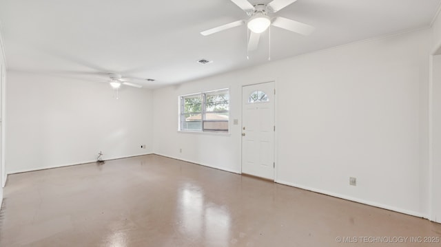 4944 Cornell Dr, Bartlesville, OK 74006 - empty room featuring ceiling fan and concrete flooring