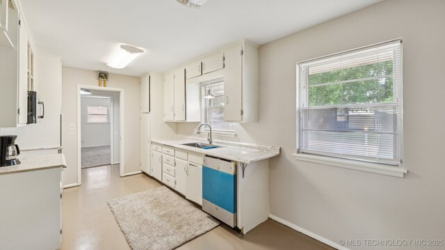 4944 Cornell Dr, Bartlesville, OK 74006 - kitchen with dishwasher, light countertops, and healthy amount of natural light