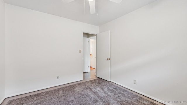 4944 Cornell Dr, Bartlesville, OK 74006 - carpeted empty room with a ceiling fan and baseboards