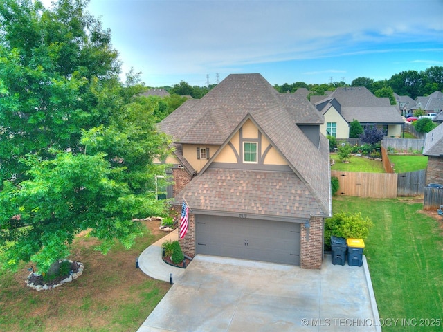2610 E 139th St S, Bixby, OK 74008 - view of front of home featuring stucco siding, brick siding, driveway, and a shingled roof