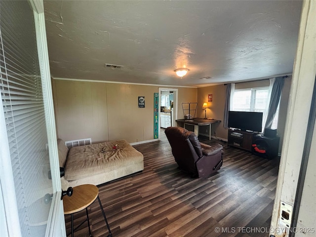 1503 Hillcrest, Durant, OK 74701 - living room featuring wood finished floors and a textured ceiling