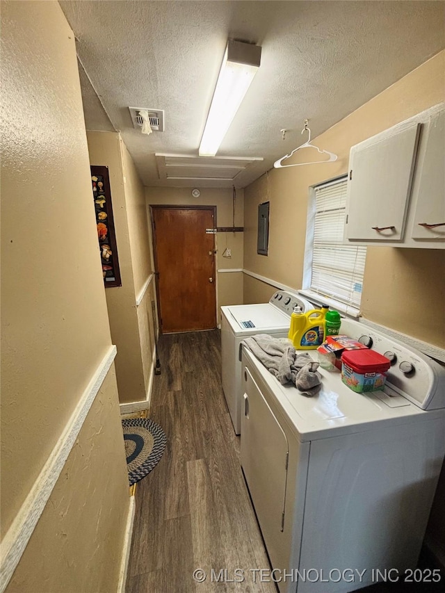 1503 Hillcrest, Durant, OK 74701 - kitchen featuring independent washer and dryer, electric panel, wood finished floors, a textured ceiling, and white cabinets