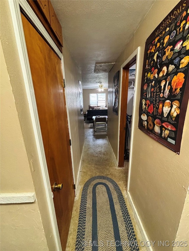 1503 Hillcrest, Durant, OK 74701 - corridor featuring a textured ceiling and carpet floors