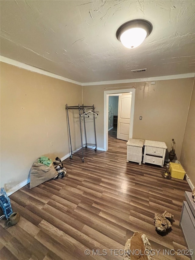 1503 Hillcrest, Durant, OK 74701 - unfurnished bedroom featuring wood finished floors and ornamental molding
