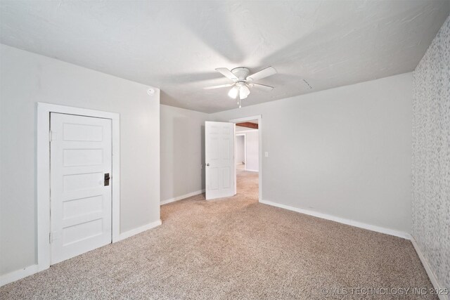 525 S 3rd Ave, Hallett, OK 74034 - unfurnished bedroom featuring carpet and ceiling fan