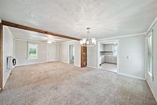 525 S 3rd Ave, Hallett, OK 74034 - unfurnished living room with a chandelier, heating unit, light colored carpet, a ceiling fan, and a textured ceiling
