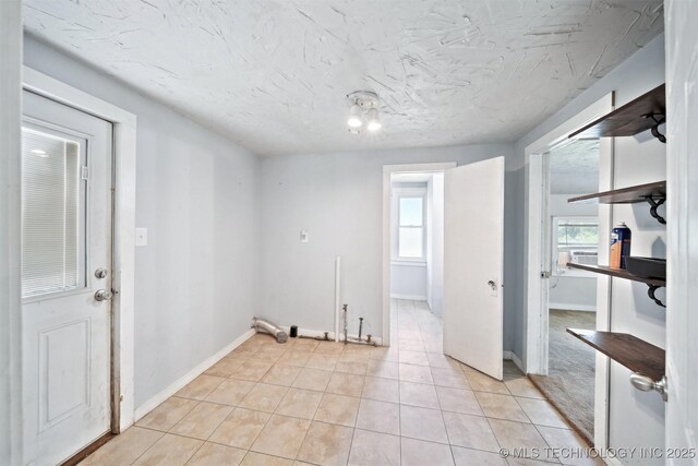 525 S 3rd Ave, Hallett, OK 74034 - laundry room with healthy amount of natural light and light tile patterned floors