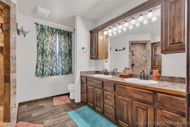 6335 S Watson, Sulphur, OK 73086 - full bath with double vanity, wood finished floors, and a tile shower