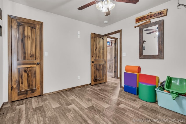 6335 S Watson, Sulphur, OK 73086 - empty room with wood finished floors, ceiling fan, and a smoke detector