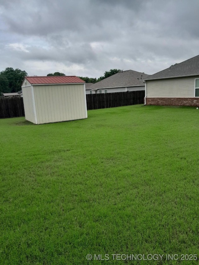 14652 S 276th E Ave, Coweta, OK 74429 - fenced backyard featuring a storage shed