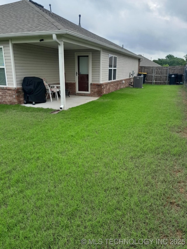 14652 S 276th E Ave, Coweta, OK 74429 - rear view of property with brick siding, a patio, and roof with shingles
