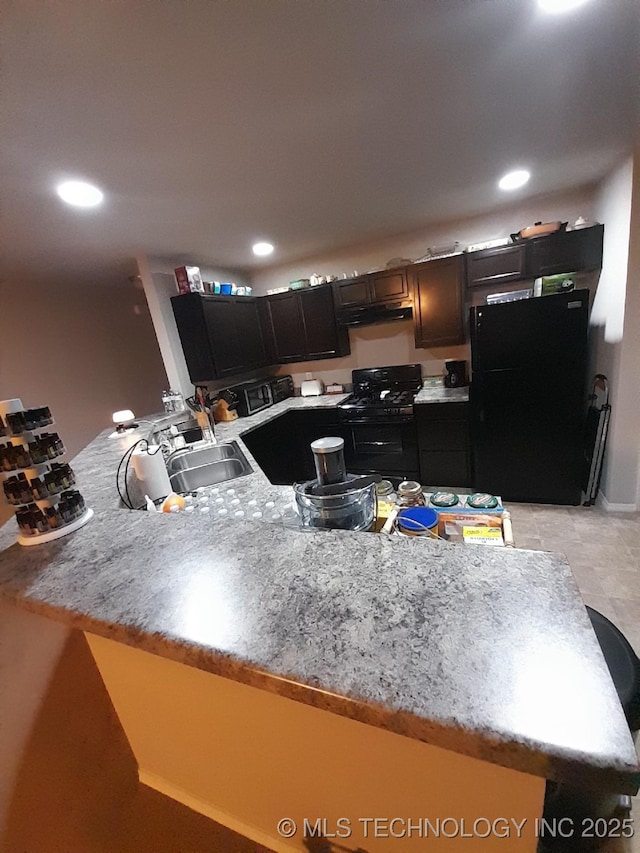 14652 S 276th E Ave, Coweta, OK 74429 - kitchen with black appliances, a peninsula, under cabinet range hood, light countertops, and recessed lighting