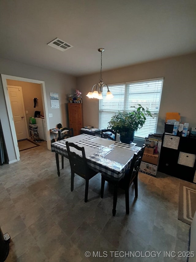 14652 S 276th E Ave, Coweta, OK 74429 - dining area featuring a chandelier