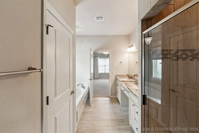 113 E 128th St S, Jenks, OK 74037 - full bathroom with double vanity, a bath, and a shower stall