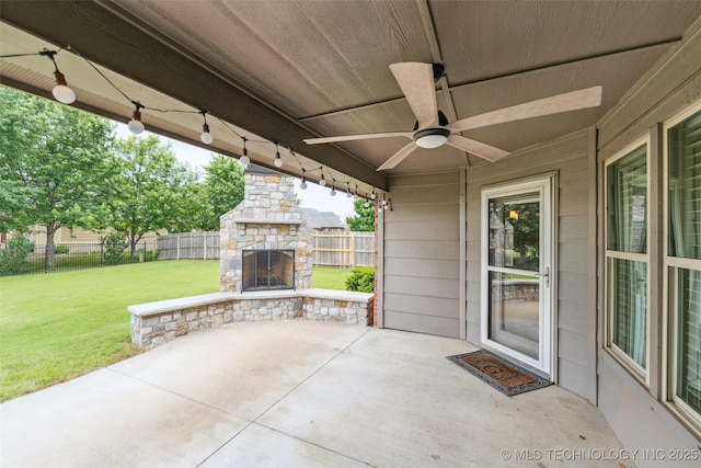 113 E 128th St S, Jenks, OK 74037 - fenced backyard with an outdoor stone fireplace, a patio area, and a ceiling fan
